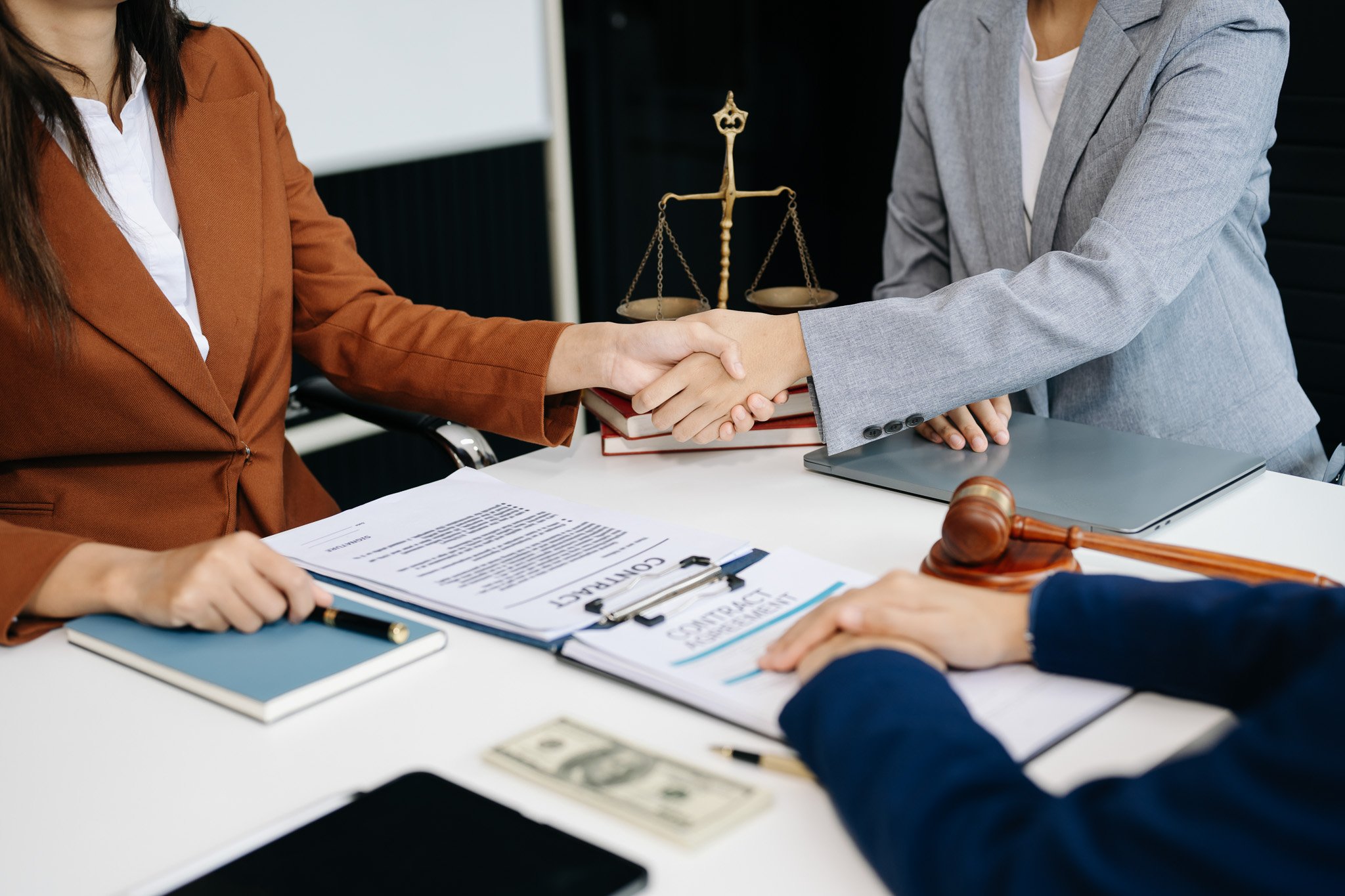 woman-lawyer-hand-and-women-client-shaking-hand-co-2024-11-01-22-08-43-utc